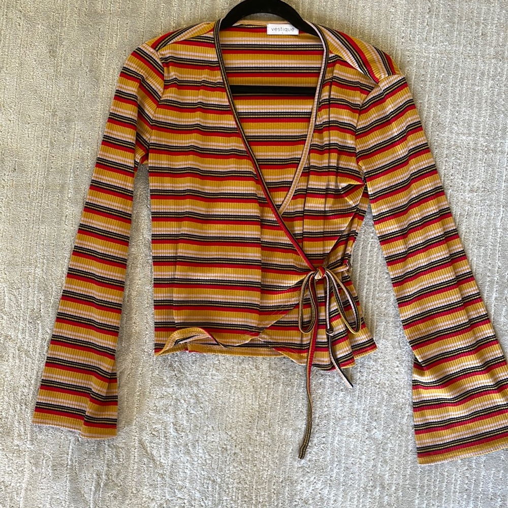 Vestique tie wrap top with bell sleeves and v neck